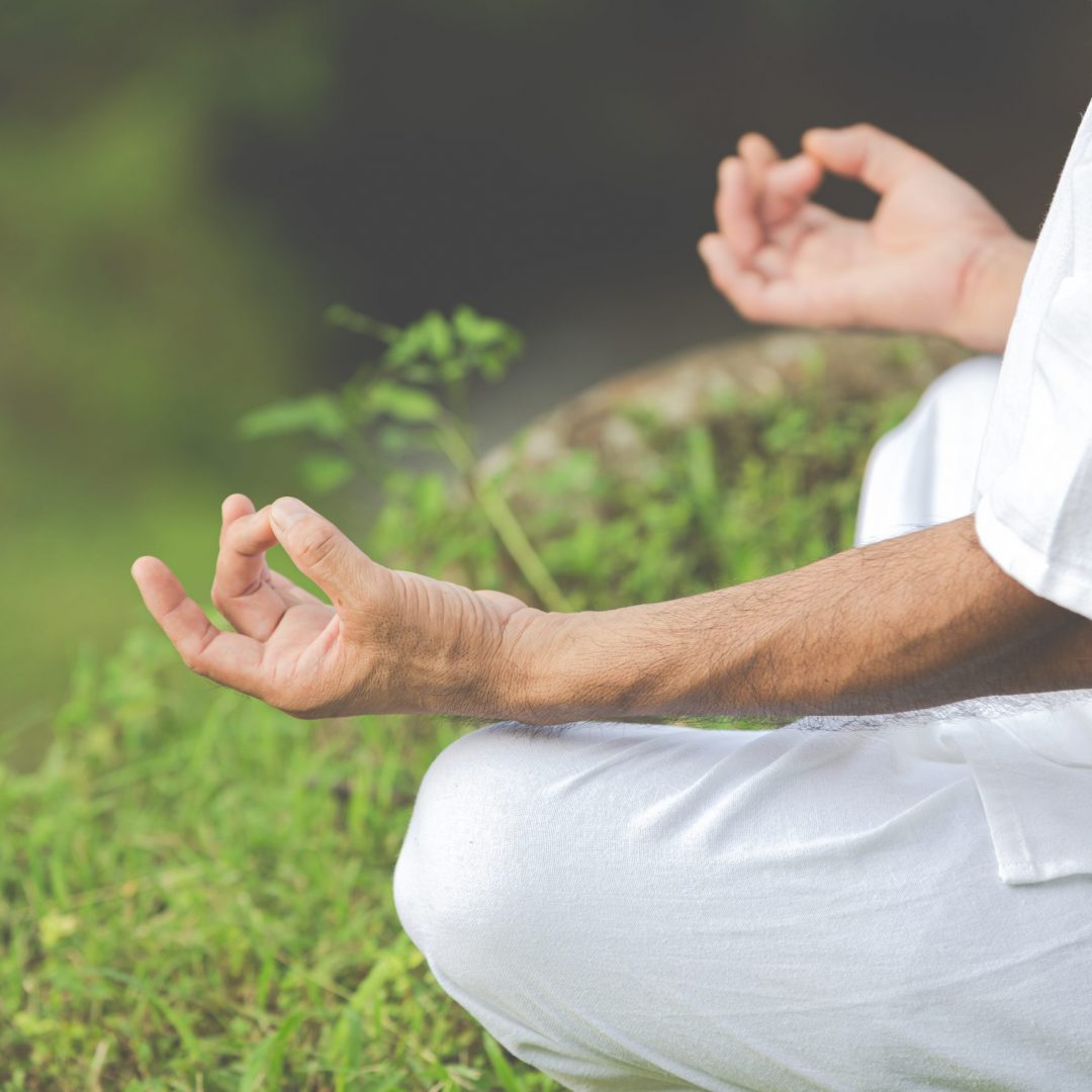 A close up picture of hands doing meditation